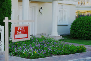 White House front door with big columns and for sale sign